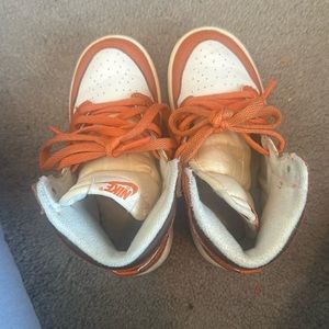 Orange with brown lining toddler Jordan 1’s Retro High